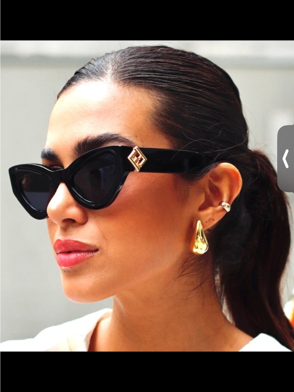 Black Cat-Eye Sunglasses with Gold Emblem